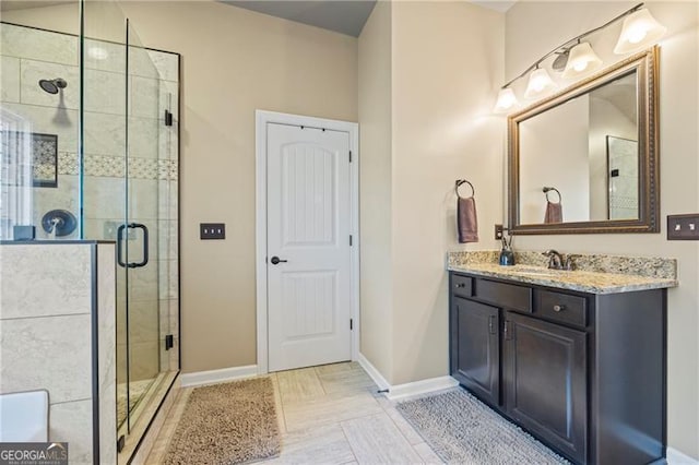 bathroom with vanity and an enclosed shower