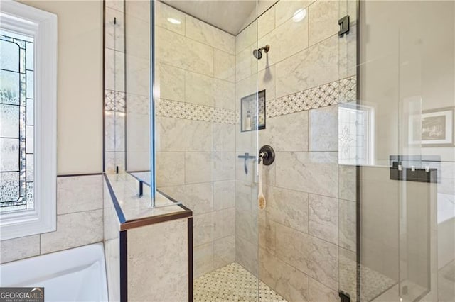 bathroom featuring an enclosed shower