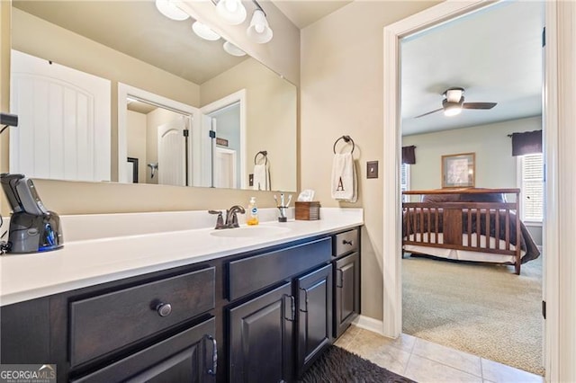 bathroom with tile patterned floors, ceiling fan, and vanity