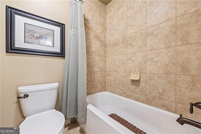 bathroom featuring toilet and shower / bathtub combination with curtain