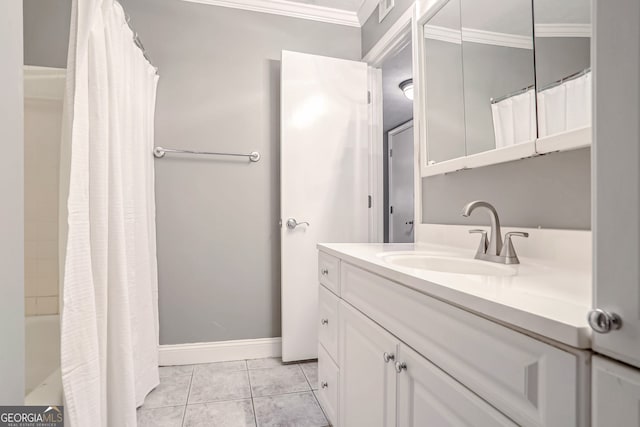 bathroom featuring tile patterned floors, vanity, and crown molding