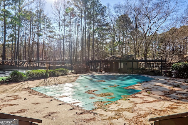 view of swimming pool with a patio area