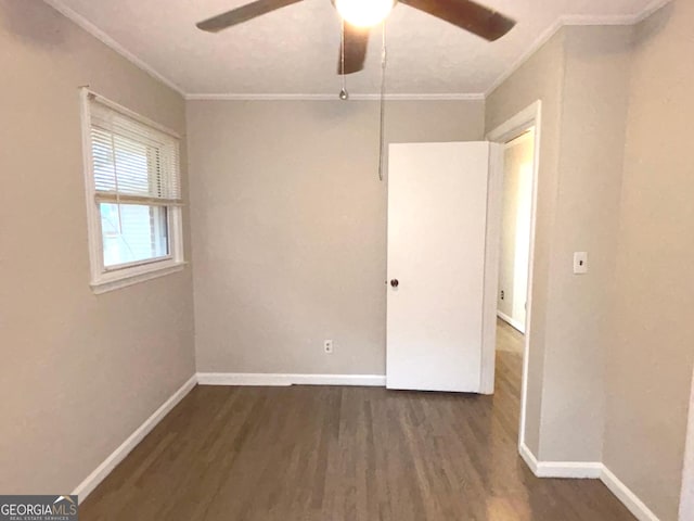 unfurnished room with dark hardwood / wood-style floors, ceiling fan, and ornamental molding