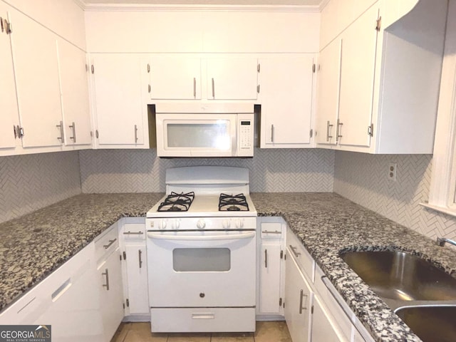 kitchen featuring decorative backsplash, white appliances, white cabinets, and sink