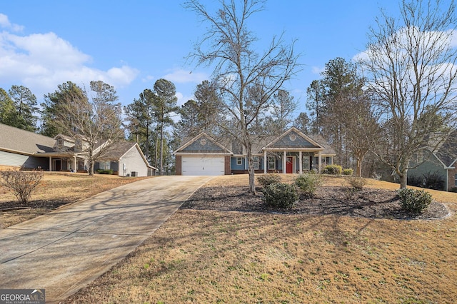 view of front of house with a front yard and a garage