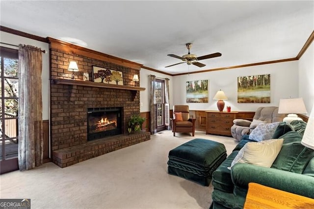 living room with a fireplace, light carpet, ceiling fan, and ornamental molding