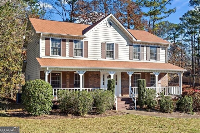 view of front facade with a porch and a front yard