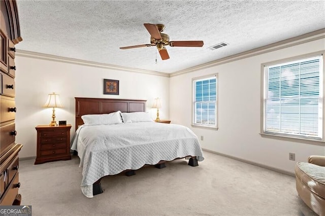 bedroom featuring multiple windows, crown molding, ceiling fan, and a textured ceiling