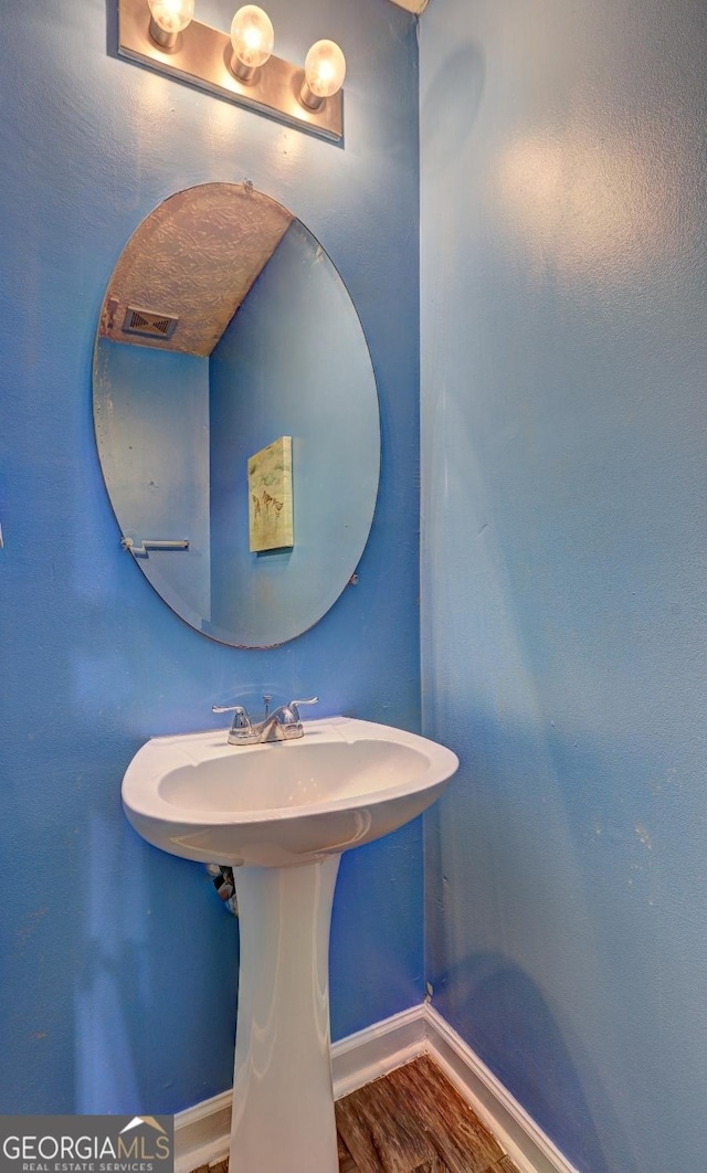 bathroom featuring hardwood / wood-style flooring