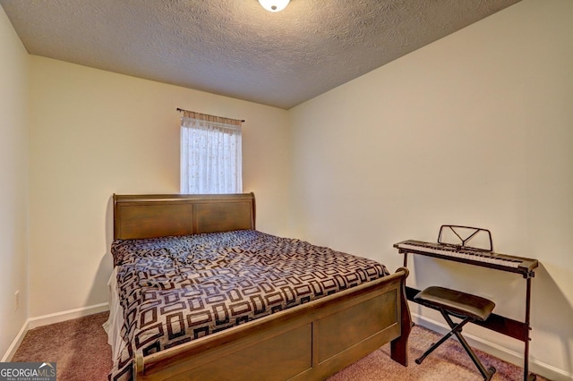 carpeted bedroom with a textured ceiling