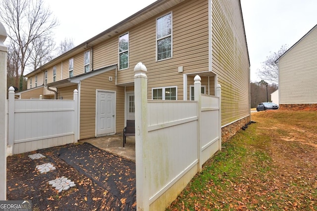 rear view of house featuring a patio