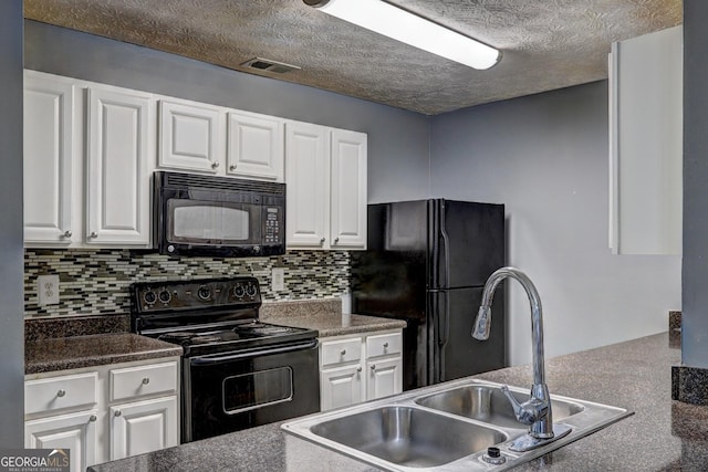 kitchen featuring black appliances, decorative backsplash, white cabinetry, and sink