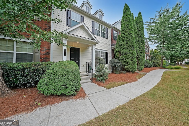 view of front of home featuring a front lawn