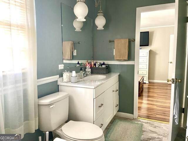 bathroom with vanity and toilet