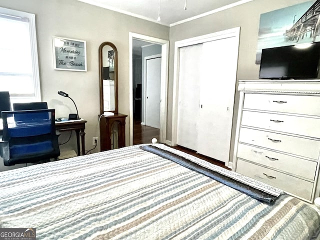 bedroom featuring a closet and ornamental molding