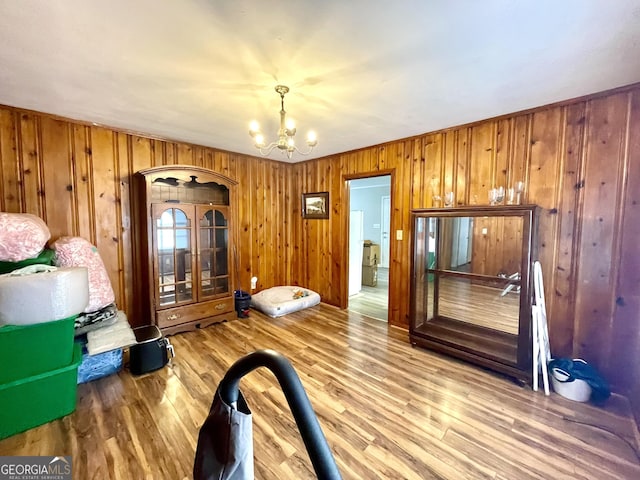 interior space featuring hardwood / wood-style floors and a chandelier