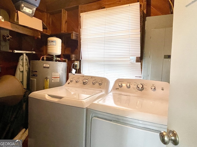 laundry area featuring water heater and independent washer and dryer