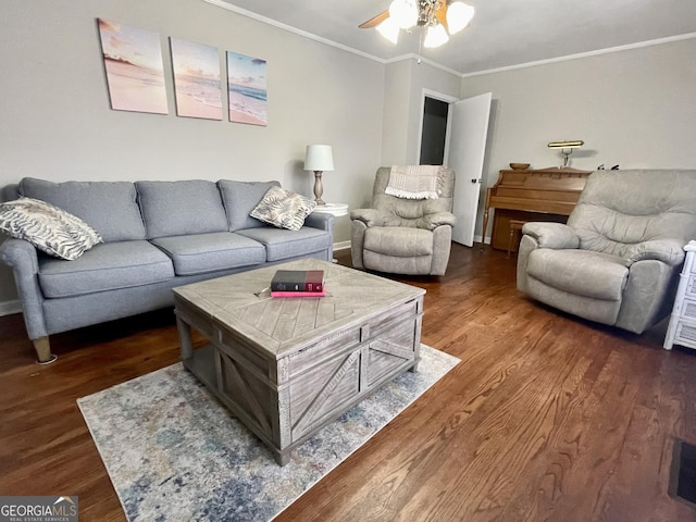 living room featuring ceiling fan, dark wood-type flooring, and ornamental molding