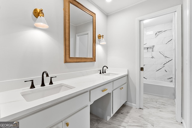 bathroom with vanity, tiled shower / bath combo, and crown molding