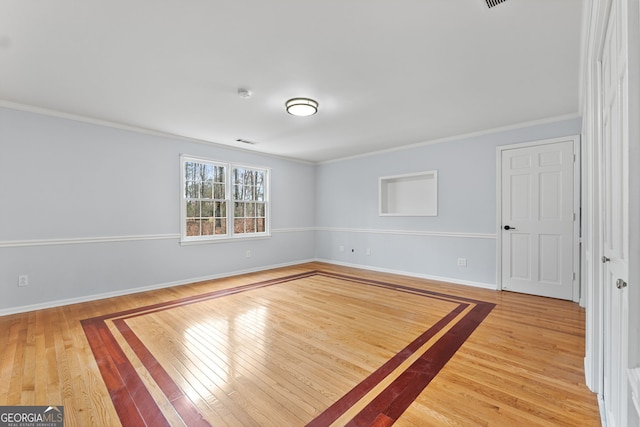 unfurnished room with hardwood / wood-style floors and ornamental molding