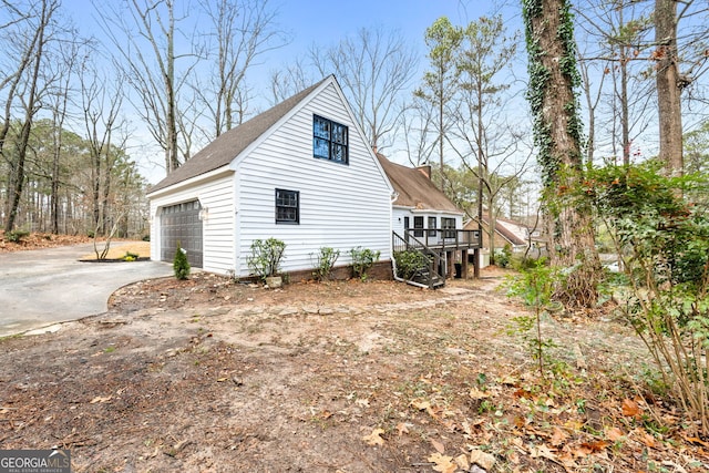 view of side of property featuring a deck