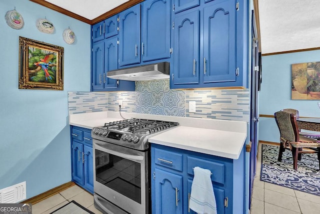 kitchen featuring light tile patterned floors, backsplash, blue cabinets, and stainless steel gas range oven