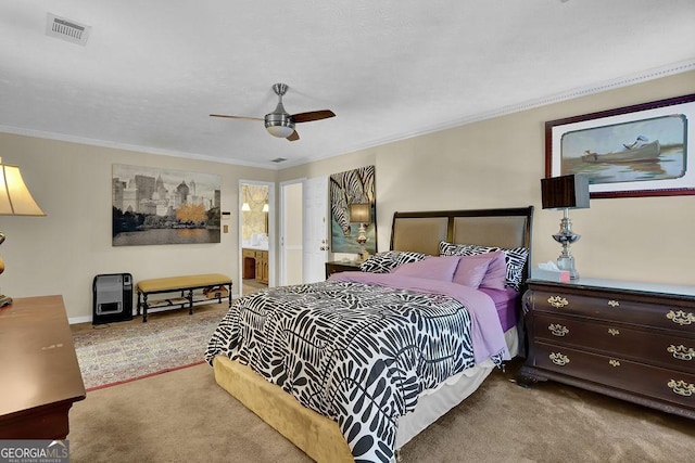 bedroom with light carpet, ensuite bath, ceiling fan, and crown molding