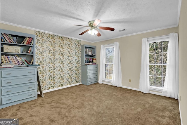 unfurnished bedroom with carpet flooring, ceiling fan, ornamental molding, and multiple windows