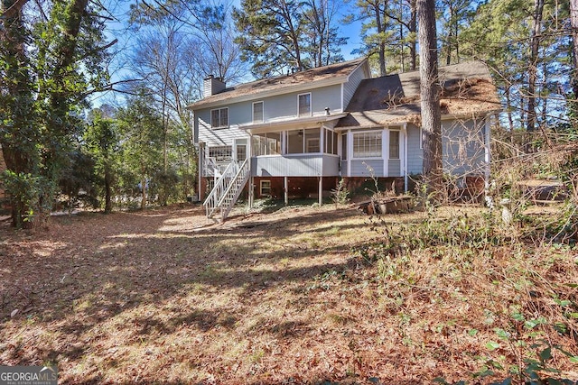 back of property featuring a sunroom