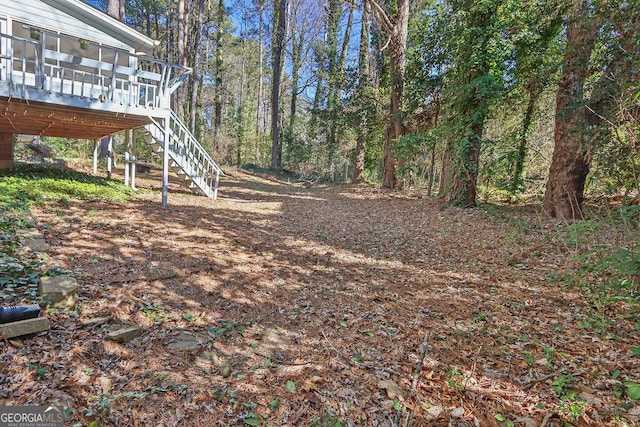 view of yard with a wooden deck