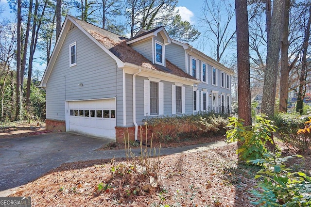 view of property exterior featuring a garage