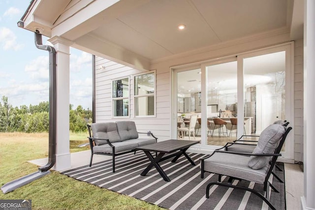 view of patio featuring an outdoor living space and sink