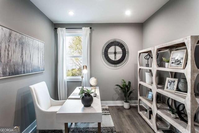 home office with dark wood-type flooring