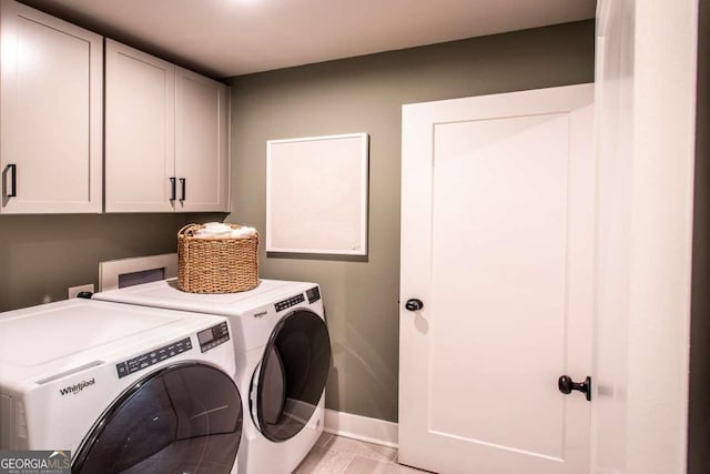 laundry room featuring cabinets and independent washer and dryer