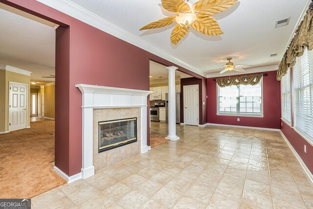 carpeted bedroom with ensuite bath and ceiling fan