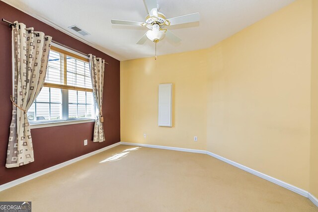 living room with ceiling fan and ornamental molding