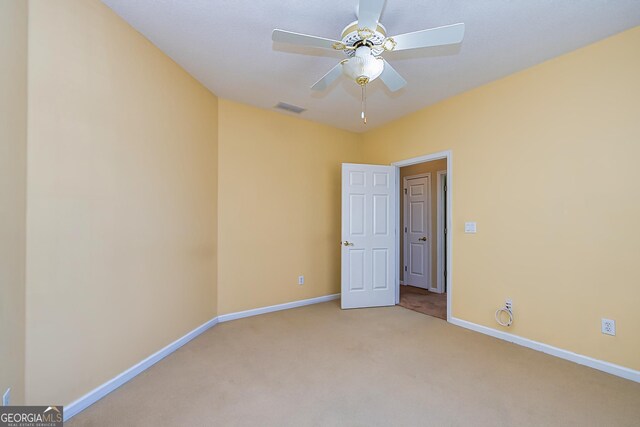 carpeted dining room with ornamental molding