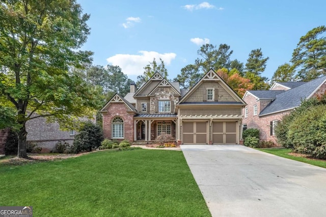 craftsman-style house featuring a garage and a front lawn