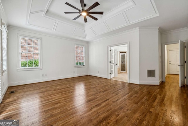 empty room with ornamental molding, ceiling fan, and dark wood-type flooring