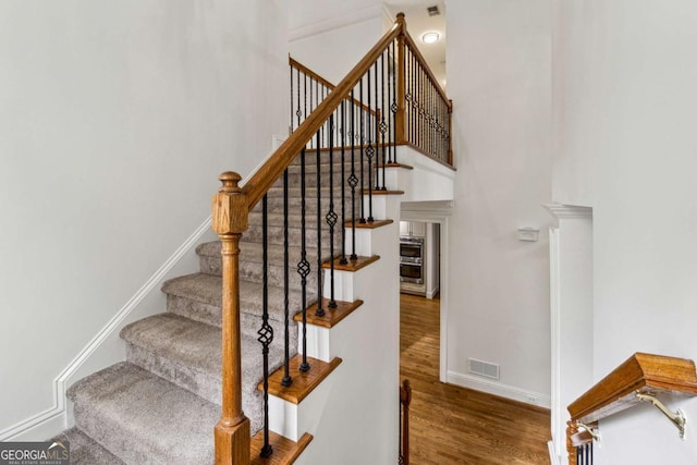 stairway with wood-type flooring