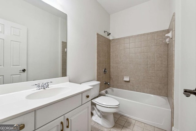 full bathroom with tile patterned floors, toilet, vanity, and tiled shower / bath