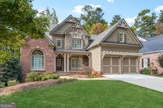 craftsman-style house with a garage and a front lawn