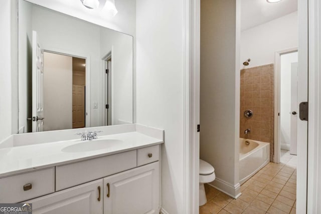 full bathroom featuring tile patterned flooring, vanity, toilet, and tiled shower / bath