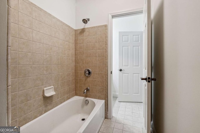 bathroom with tile patterned floors and tiled shower / bath combo