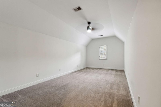 bonus room with carpet floors and lofted ceiling