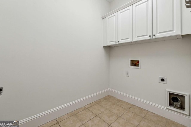 laundry room featuring washer hookup, electric dryer hookup, cabinets, and light tile patterned floors