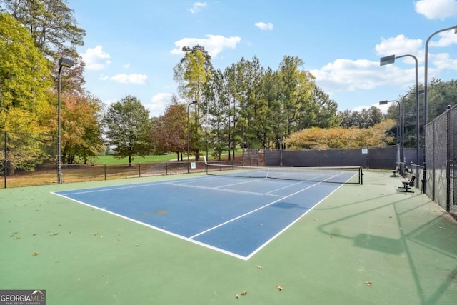 view of sport court featuring basketball hoop