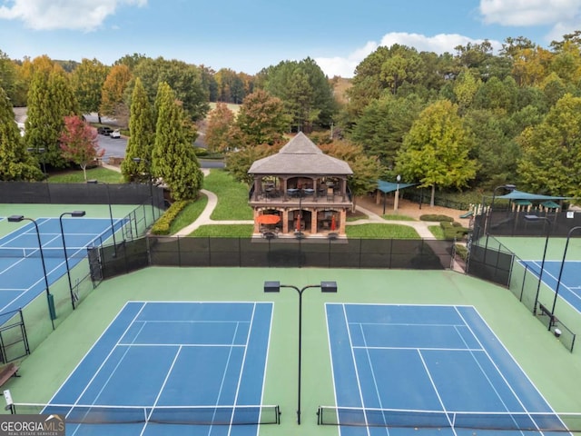 view of tennis court featuring a gazebo