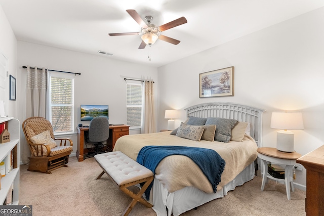 carpeted bedroom with ceiling fan