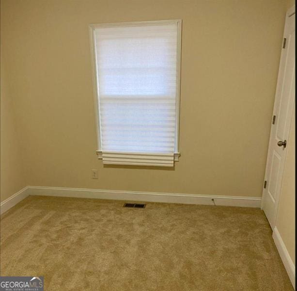 empty room featuring carpet flooring